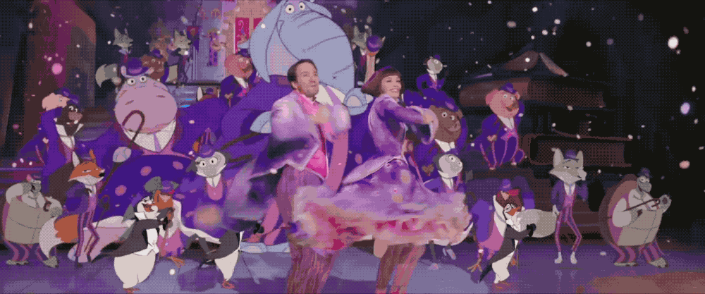 animated GIF of Emily Blunt and Lin-Manuel Miranda plus a penguin
